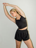 Model wearing High waist lounge shorts with ribbed waistband in black