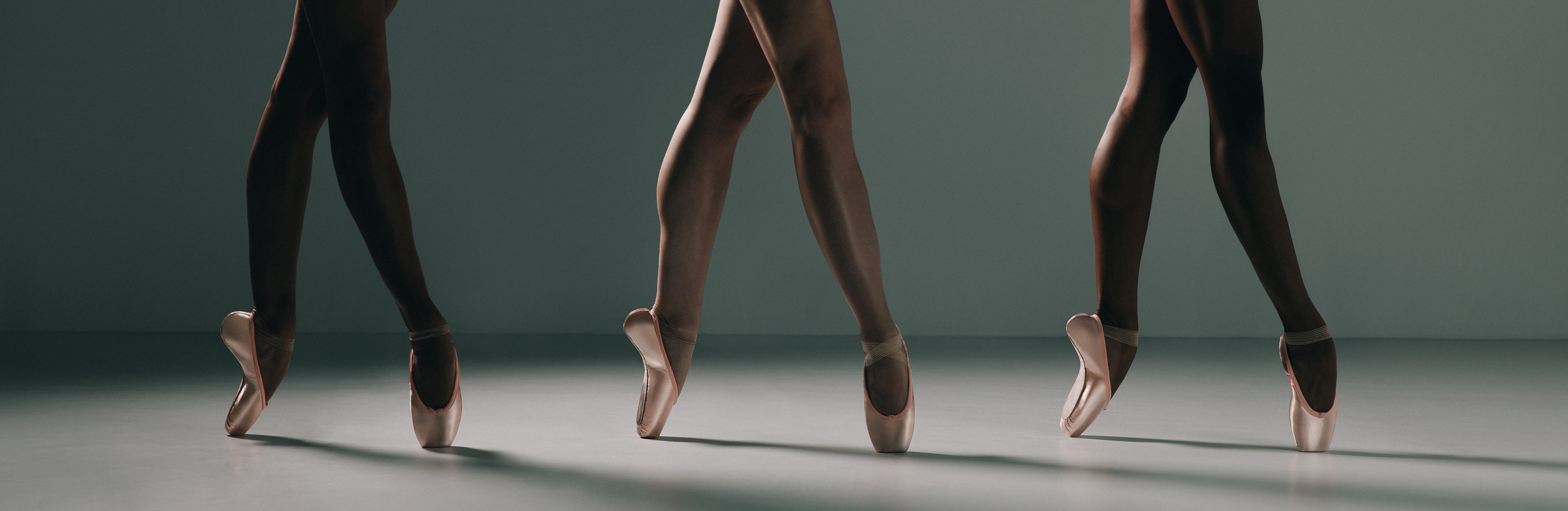 Three dancers wearing Camber pointe shoes